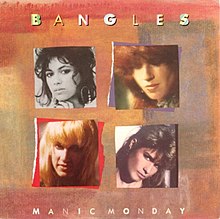 Four pictures of four women placed in a multicolor background. The words "Bangles" and "Manic Monday" are written in white capital letters. The upper left photo contain a woman with white face and black hair. The upper right photo is about a red-haired woman. The girl of the third picture, located lower left, is blonde, while the girl of the lower right is a brunette.