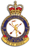 Crest of 34 Squadron, Royal Australian Air Force, featuring winged messenger in gold, two crossed arrows, and the motto "Eo et redeo"