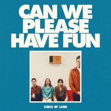 A photo of the band with one member standing and the other three sat on a couch. The photo is small and in the bottom-middle, with the title in large, white block letters above, all over a blue background.