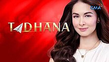 An image of Marian Rivera, over a red glossy background. The series title is displayed on the left side of the image. The logo of GMA Network is displayed on the upper right side of the image.