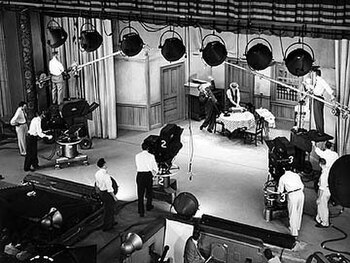 A photo of the TV studio set with cameras pointed on the kitchen setup