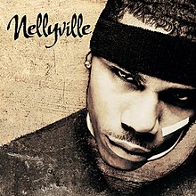 A sepia image of Nelly's face partially obscured on the right side of the cover. He is wearing a black headband and shirt, with a white band-aid across his left eye.