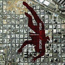 An upside-down shadow of a person over a satellite view of downtown San Diego