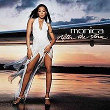 Monica in a white dress standing on a wet runway in front of the wing of a plane, with a somewhat cloudy sky at sunset behind her, with her name and the title to the right.