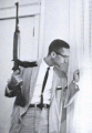 Malcolm X guards his family in an iconic Ebony photo taken by Charles.