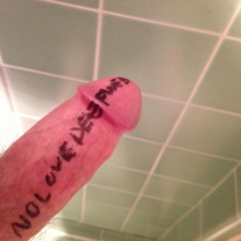 A photograph of a human penis, with the words "NO LOVE DEEP WEB" written on it.