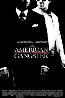 A black-and-white picture, depicting Frank Lucas in a black suit and Richie Roberts in a white one. In front of them is the title American Gangster, with Russell Crowe and Denzel Washington's names above, and the film credits below.