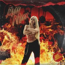 Max is seen posing topless in front of a red background covered in flames.