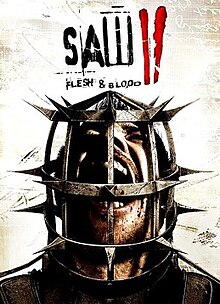 An image of the boxart which features a man's head inside a steel cage behind a mostly beige backdrop. The words "Saw II Flesh & Blood" are written above the man in black letters with a red "II", made to resemble finger streaks of blood. The cropped official North American box art