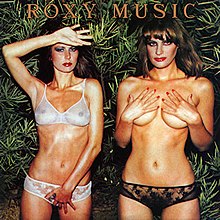 a topless woman covering her breasts (right) and a woman in see-through lingerie (left) on a background of plants