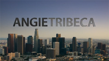 A city view with the words ANGIE TRIBECA against the blue sky, the first word in black text, the second in gray text
