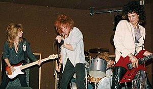 Hollywood Rose playing Madame Wong's East on 28 June 1984. From left to right, bassist Steve Darrow, singer Axl Rose, drummer Steven Adler, and guitarist Slash.