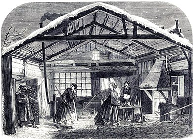 Scene in a large hut, with heavily wrapped figure entering from left, with a flurry of snow blown in after him