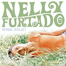 On a white background, Furtado lies on the grass on her side, looking at the camera. "Nelly Furtado" is written in 60s-inspired forest green capital letters, and "Whoa, Nelly!" in smaller, light-blue capital letters.