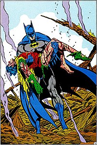 Batman, a superhero wearing gray spandex and a blue cape, cowl, gauntlets, and boots, cradles the mangled, lifeless body of Jason Todd (Robin), who is covered in blood and wearing a tattered red, green, and yellow costume.