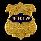 CDP badge - features number (for patrol officers) or rank in the middle. Pictured here is a detective's badge