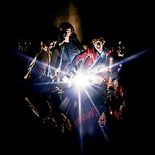 A painting of the band members with an explosion of light in the center