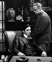 A screenshot of Michael and Vito Corleone in The Godfather