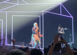 A color photograph of Gwen Stefani performing live.