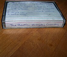 A cassette tape with the words "The Beatles-Everyday Chemistry" and the tracklist of the album written on it
