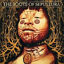 The focus of the cover is the bust of a Amazonian tribesman with native-style facial tattoos and a large number of bead necklaces including one with a pendant of the band's "S"-shaped logo. The tattoos are mostly line based with bilateral symmetry but there are two circular designs below the eyes and another ring-like design below his right eye. The necklaces have the same design which consists of mostly white beads but occasionally a green or red bead with black beads adjacent. The bust is actually split in two as the the man's neck is transparent, allowing the background to be seen, which consists of a network of arteries in light orange on a black background. The words "THE ROOTS OF SEPULTURA" appear at the top in an uppercase font surrounded by a rectangle with rounded corners. The word "ROOTS" is in outline font instead of filled.