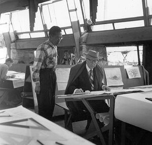 Ling Po and Frank Lloyd Wright in Taliesin West drafting room