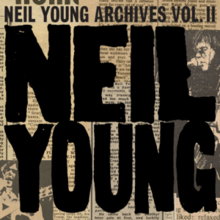 A very large black "NE" with "NEIL YOUNG ARCHIVES VOL. II" written above it on top of newspaper clippings