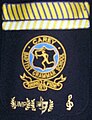 An example of a blazer pocket from Carey Baptist Grammar School with school colours in umpiring and musical theatre, as well as house colours and music insignia. Pockets are a common method of displaying awards.