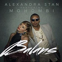 Stan and Mohombi staying close to each other in front of a grey background, with the song's title, "Balans" being displayed in front of them