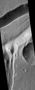 Minio Vallis Hanging Valleys, as seen by HiRISE. Two hanging valleys are visible, as well as many dark slope streaks.