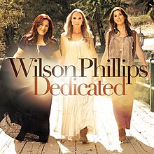 The members of Wilson Phillips standing and smiling