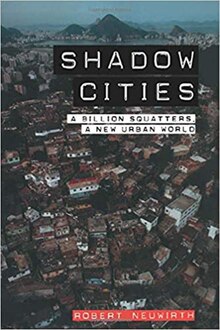 The book cover showing title over a picture of an informal settlement