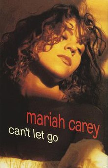 Headshot of Mariah Carey with eyes closed looking to her left