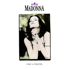 Madonna with her hands folded in prayer. Her image is enclosed in a square white frame.