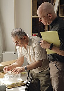 Father Najeeb Michaeel (left) and Dr. Columba Stewart (right) examining manuscripts for digitization at CNMO (Centre Numérique des Manuscrits Orientaux) in Qarah Qūsh, Iraq, in June 2012. Fr. Najeeb became the Chaldean Catholic Archbishop of Mosul and, because of continued instability in the region, CNMO and its remaining manuscripts move to Erbil, Iraq.