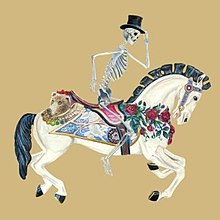 A skeleton with a top hat rides a merry-go-round horse
