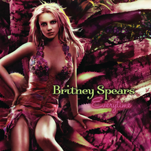 Image of Britney Spears. She is sitting in a giant purple flower wearing a dress in the same style. In the middle of the image, the words "Britney Spears" are written in green capital and small letters. Below them, the word "Everytime" is written in purple italics.