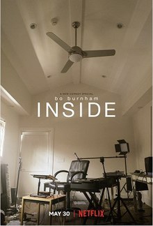 A filming setup and a ceiling fan are located within a small room. In small black letters, the words "A Netflix Original Special" can be seen above the medium-sized name "Bo Burnham", which itself is above a larger, all capitalized, title: "Inside".
