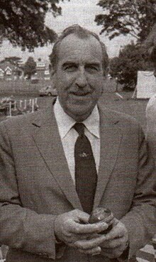 A black and white photo of a man in a jacket