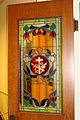 rebuilt stained glass window door to the chapel.