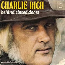 Cover of the Behind Closed Doors album with the singer Charlie Rich in a cowboy hat.