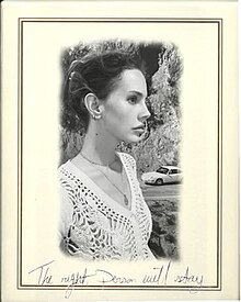 A black-and-white photograph of Del Rey's right side, inside an off-white frame with the album's name handwritten at the bottom.