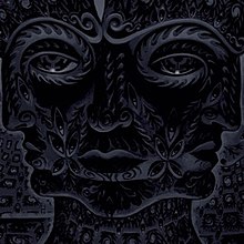 Cover art for 10,000 Days, done by artist Alex Grey, featuring what he describes as "a blazing vision of an infinite grid of Godheads during an ayahuasca journey"