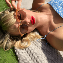 The single cover sees Taylor Swift lying on a picnic rug on grass, wearing sunglasses.