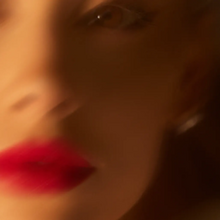 Standard cover art of "Yes, And?": a defocused picture of the left side of Grande's face