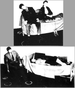 Two achromatic photographs: the top one shows a male dummy in a suit sitting on the couch with the head slumped to the side and, to the right, a female dummy sitting on a sofa with her legs drawn up on the cushions; the bottom picture shows a similar male dummy sitting in a chair with the head slumped down and, to the right, a female dummy laying down on a sofa.