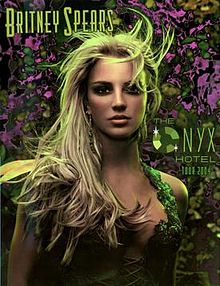 Image of a blond woman. She is wearing a dress, laced up in the front. Her hair seems to be moving. The woman is looking directly into the camera. In the left above the woman, the words 'BRITNEY SPEARS' are written in green long handwriting. In the right of the woman's face, the words "THE ONYX HOTEL TOUR 2004" are written, with the O of Onyx replaced with a diamond.