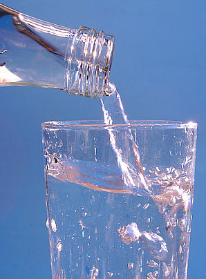A glass of mineral water being poured