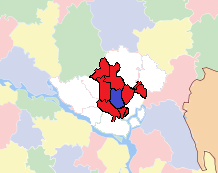 Dhaka city is shown in blue and other towns and cities are shown in red