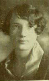 A young white woman with short curled hair